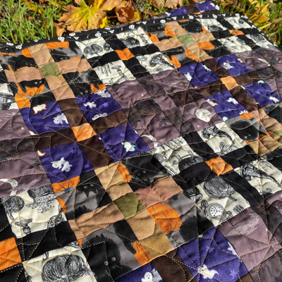 a close-up of a halloween-themed quilt