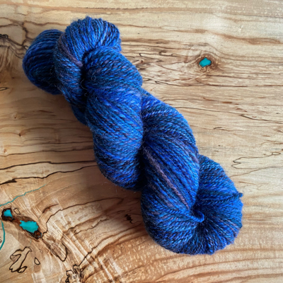 a skein of blue handspun yarn