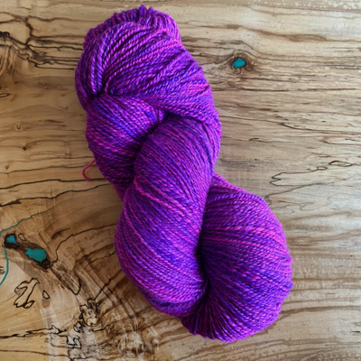 a skein of luminous purple handspun yarn