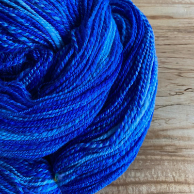 a close-up of blue handspun yarn