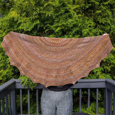 a half-moon shawl in shades of brown
