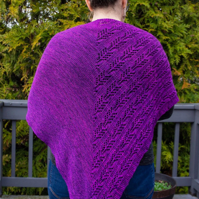 a blindingly purple triangular knitted shawl