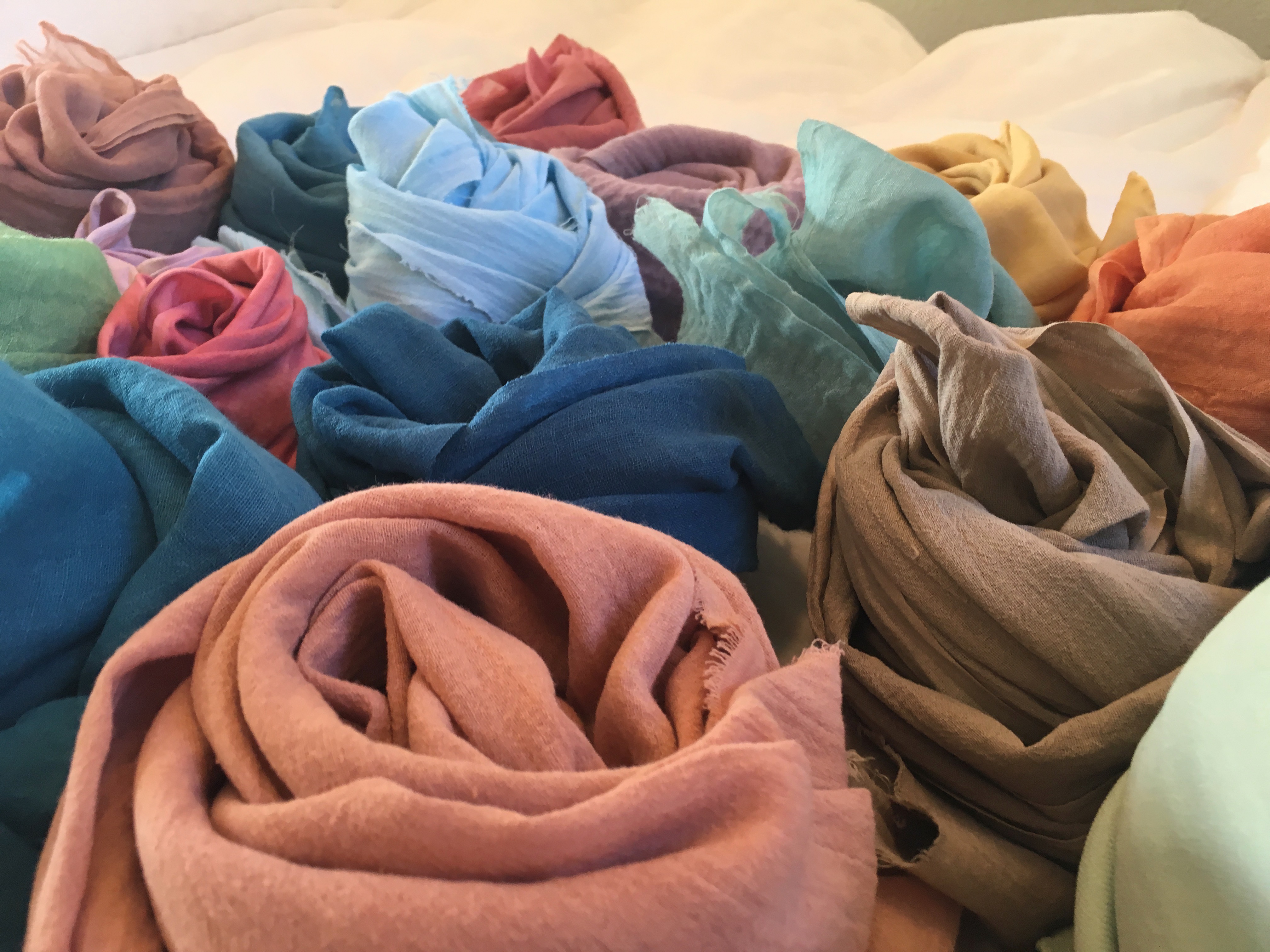 a bundle of colorful hand-dyed scarves